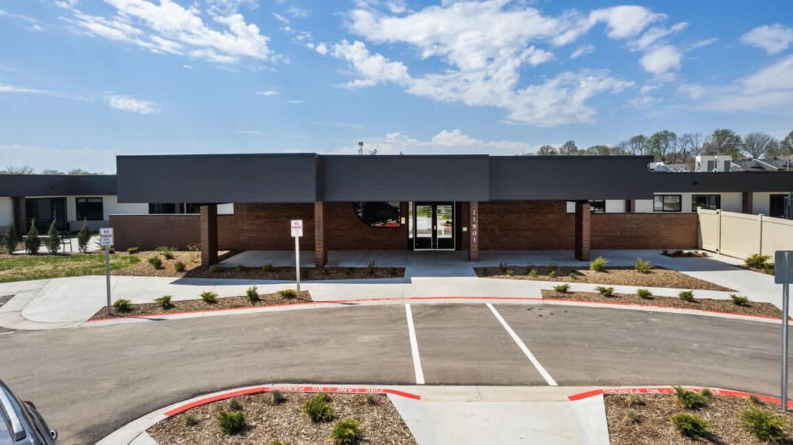 a building with a parking lot in front of it.