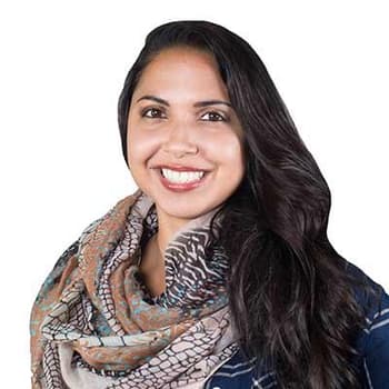 a woman with long hair wearing a scarf.