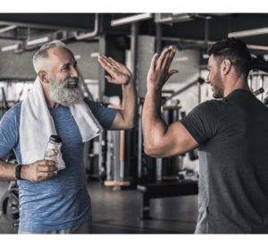 Cheerful males are talking to each other in modern gym-1