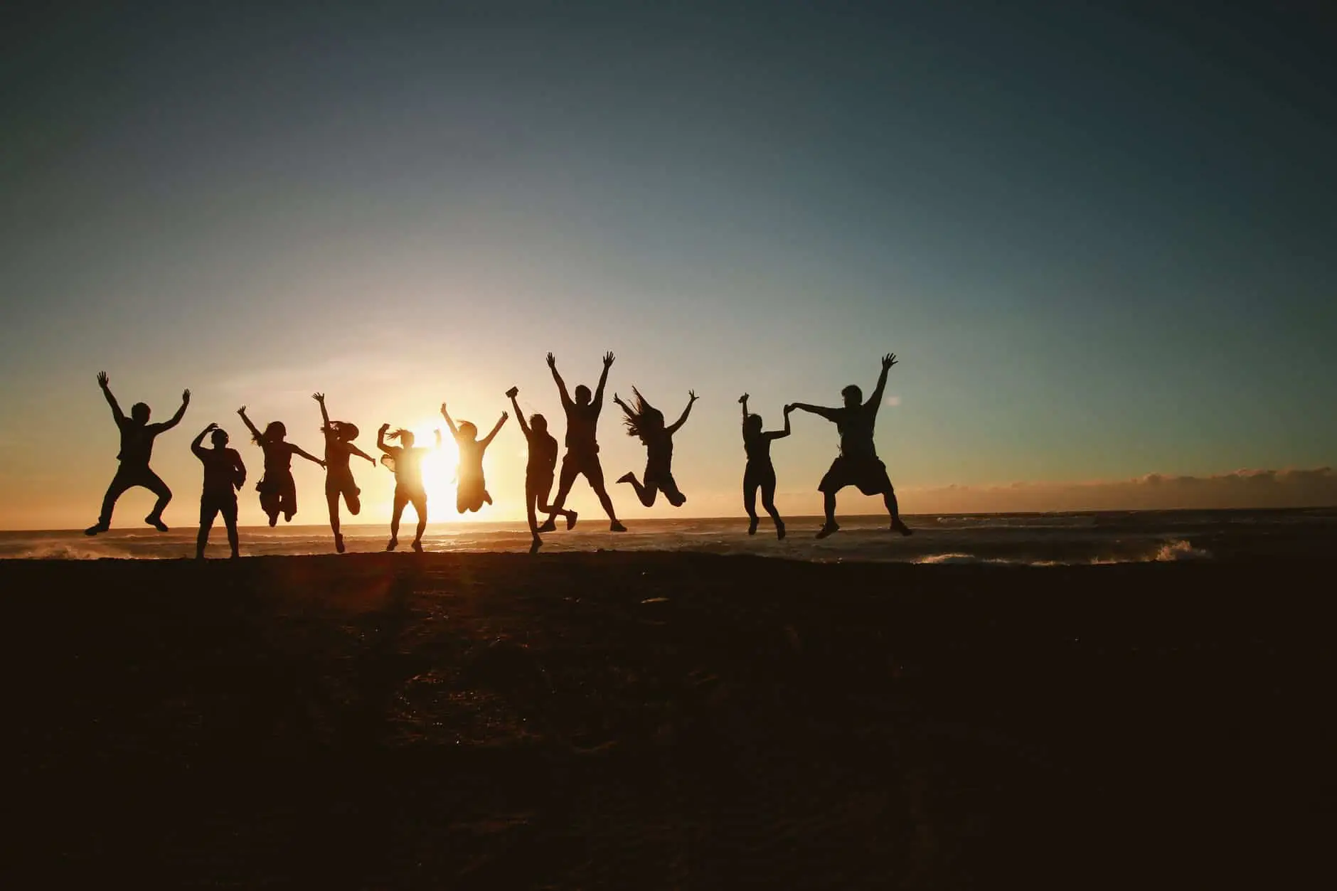 team celebration at sunset